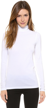 Kylie Jenner Wearing White Skirt and Turtleneck | POPSUGAR Fashion