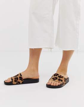 ASOS DESIGN Fizzer leather sliders in leopard