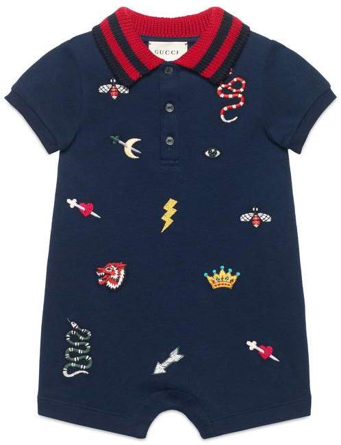 Baby sleepsuit with symbols embroidery