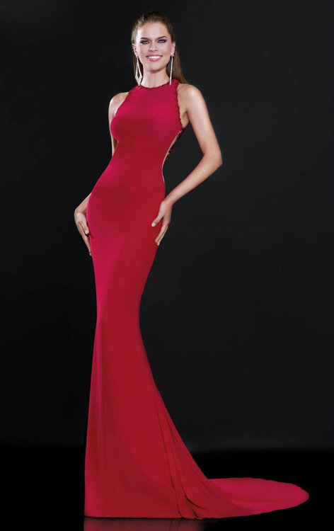 Steal the spotlight wearing this beautiful and daring evening gown by Tarik Ediz 92546. This gorgeous slim silhouette gown features a halter neckline edged exquisitely with sequins. The back is detailed with sheer fabric embellished with beaded floral patterns. The slim skirt drops down with flare on the floor and finishes with sweep train. Inspire awe in this captivating Tarik Ediz creation.