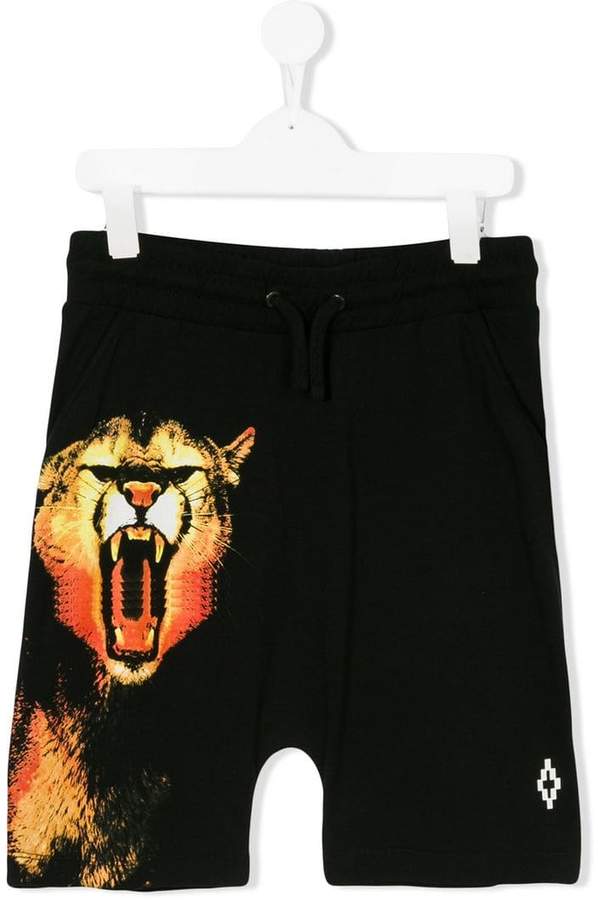Buy Marcelo Burlon County Of Milan Kids tiger print drawstring shorts!