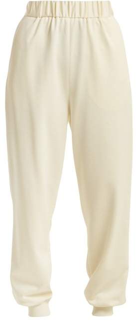 Buy Sculpted elasticated-waist piqué trousers!