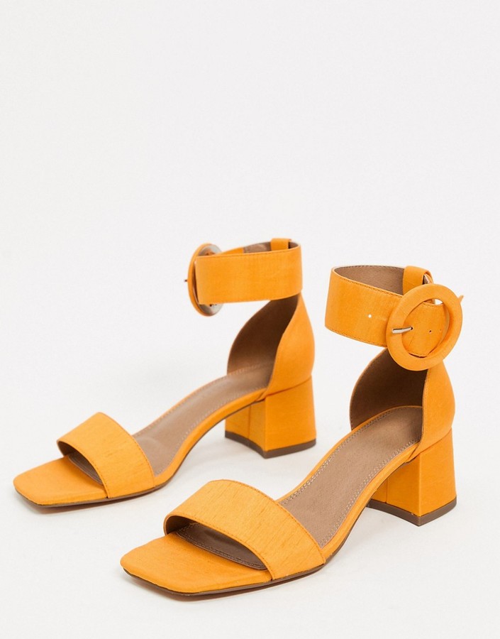 orange designer heels