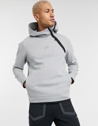 Nike Tech Fleece asymmetric half-zip hoodie in gray - ShopStyle