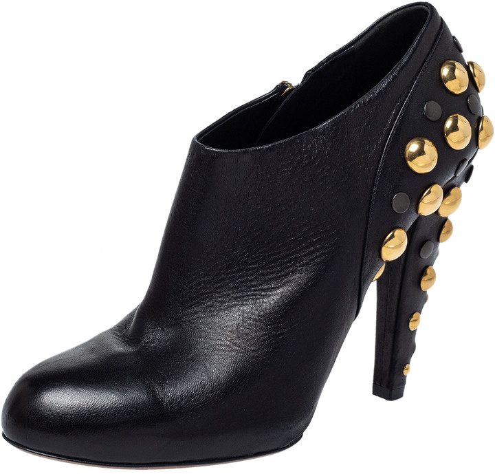 black ankle boots with gold studs