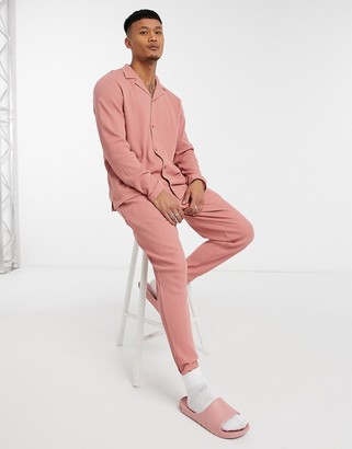 ASOS DESIGN tapered trackies with fixed hem in pink waffle