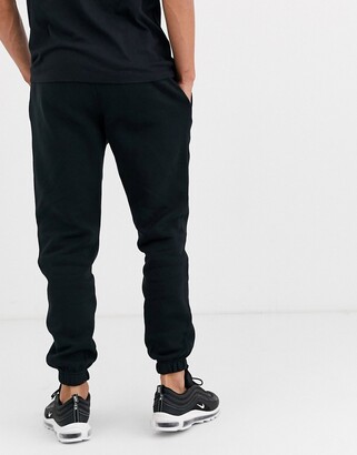 Nike Club casual fit cuffed joggers in black - ShopStyle