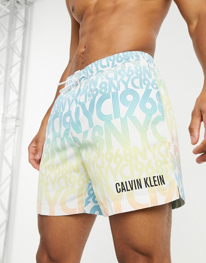 Calvin Klein medium length swim shorts in typo print - ShopStyle