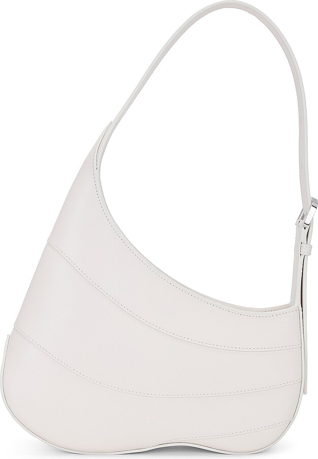 ALAÏA Djinn Zipped Hobo Bag in Ivoire in Ivory
