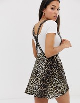 Thumbnail for your product : ASOS DESIGN Petite button front mini pinafore skirt in leopard print