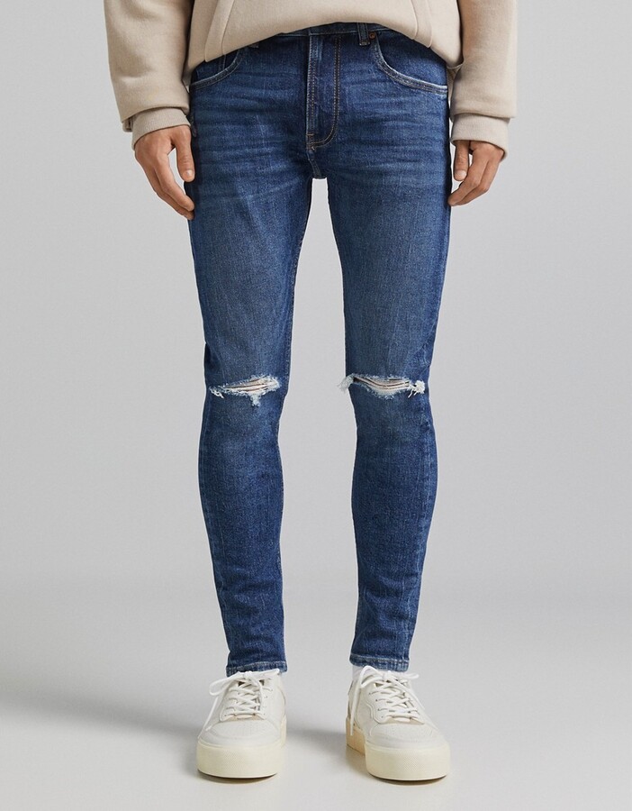 Bershka super skinny jeans with rips in mid blue - ShopStyle