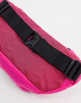 The North Face Lumbnical small bum bag in dark pink