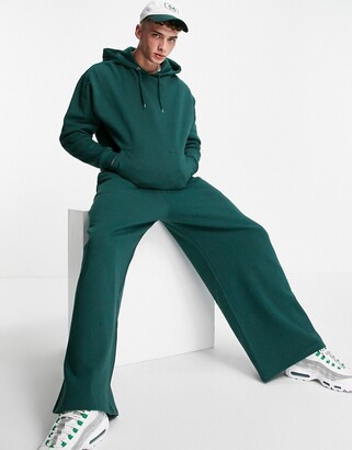 ASOS DESIGN oversized tracksuit with hoodie and wide leg sweatpants in  forest green - ShopStyle