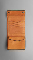Thumbnail for your product : Burberry Embossed Check Leather Foldover Wallet