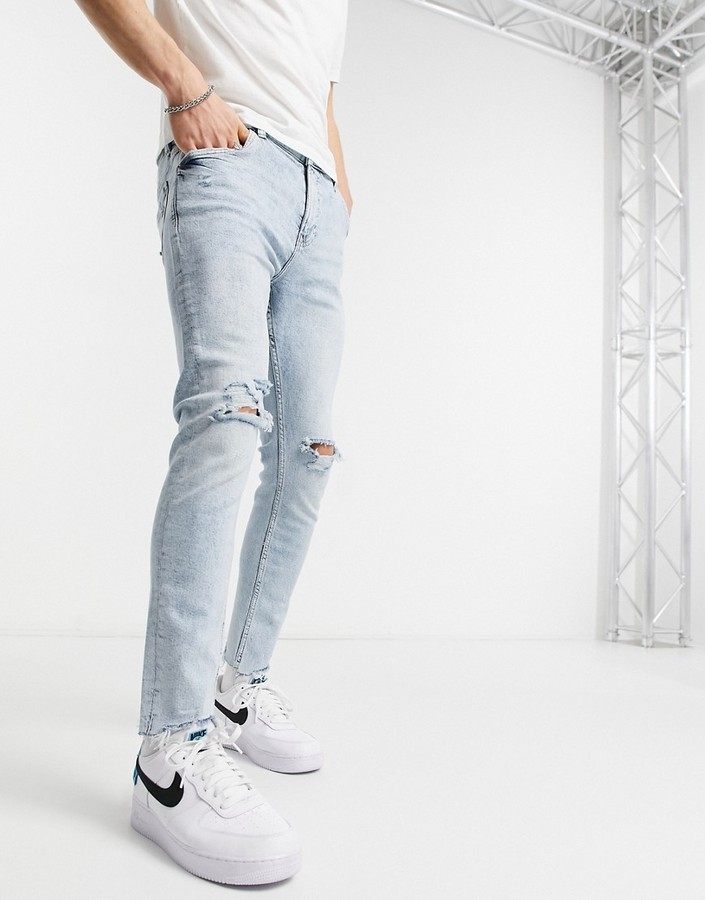 Bershka super skinny fit jeans in light blue wash with rips - ShopStyle