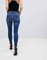 Thumbnail for your product : ASOS Petite DESIGN Petite Lisbon midrise skinny jeans in kyla wash with raw hem-Blue