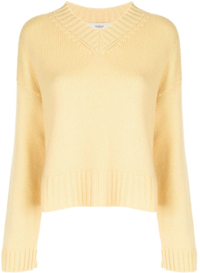 white and yellow sweater