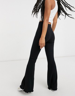 Bershka ribbed flare trousers in black - ShopStyle