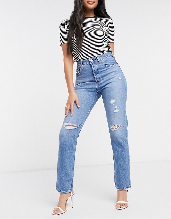 Light Blue Ripped Jeans Shop The World S Largest Collection Of Fashion Shopstyle
