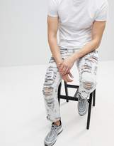 Thumbnail for your product : ASOS DESIGN Slim Jeans In Acid wash Gray With Heavy Rips and Check Patches