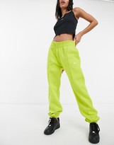 Thumbnail for your product : Nike mini swoosh oversized trackies in yellow