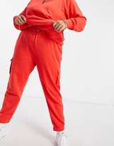 Thumbnail for your product : Nike Swoosh Plus fleece trackies in red