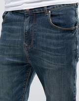 Thumbnail for your product : ASOS Design Tapered Jeans In Dirty Blue Wash