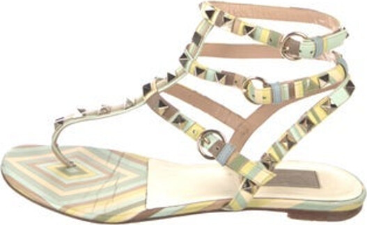 Valentino Leather T-Strap Sandals Blue, Green & Yellow Rockstud Accents Studded Accents Multistrap & Buckle Closure at Ankles Includes Dust Bag Unfortunately, due to restrictions, this item may not be eligible for shipping in all areas.