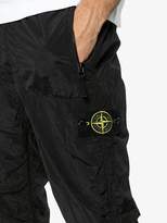 Thumbnail for your product : Stone Island logo embellished trousers