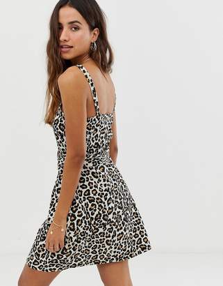 ASOS DESIGN square neck linen mini sundress with wooden buckle and contrast stitch in leopard print