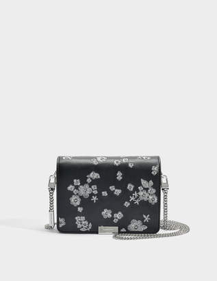 MICHAEL Michael Kors Jade Medium Gusset Clutch in Black Flower Embroidered Leather
