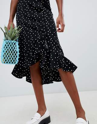 Monki polka dot side buttoned midi skirt in black