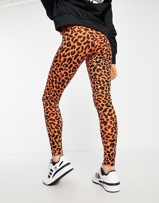 adidas x Rich Mnisi all over leopard print legging in orange
