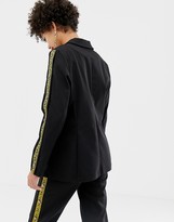 Thumbnail for your product : NA-KD popper detail blazer in black with tiger stripe