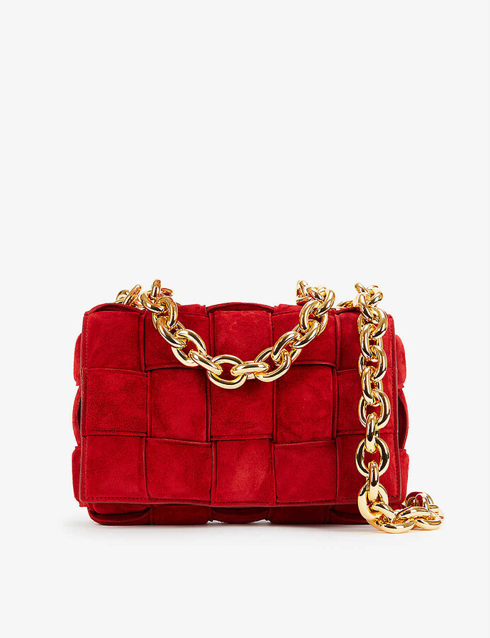red purse with gold chain