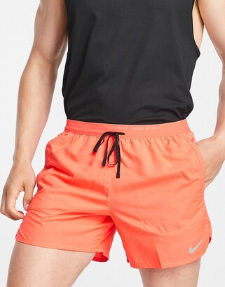 Nike Running Stride Dri-FIT 5 inch shorts in red - ShopStyle