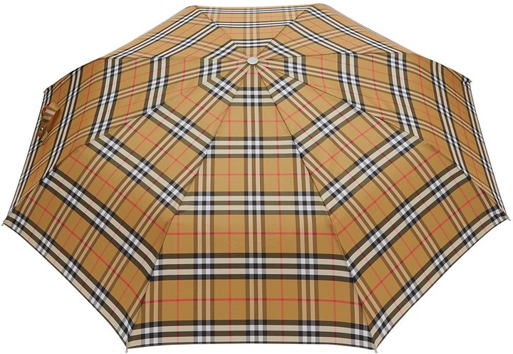 - Save 30% Burberry Leather Vintage Check Folding Umbrella in Beige Womens Accessories Umbrellas Natural 