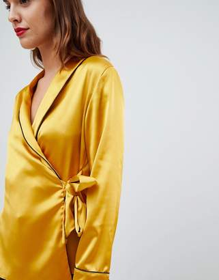 ASOS DESIGN satin wrap top with piping detail and long sleeves