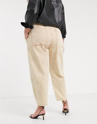 ASOS DESIGN Curve tapered boyfriend jeans with d-ring waist detail with curved seams in washed lemon