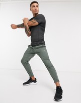 Thumbnail for your product : ASOS 4505 woven skinny tapered running joggers with reflective zip detail in khaki