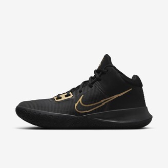 black nike shoes with gold logo