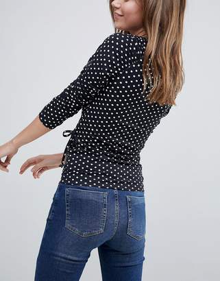 ASOS Design Wrap Top With Tie Side And Ruched Sleeve Detail In Spot Print