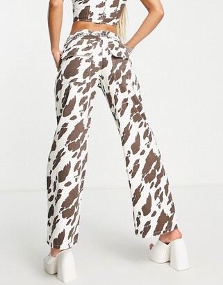 ASOS DESIGN relaxed dad jean in cow print - ShopStyle