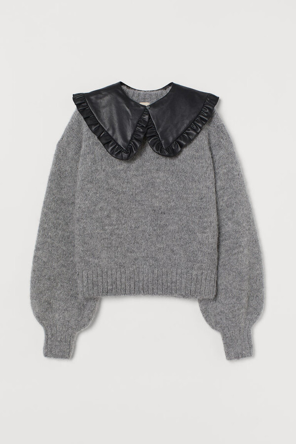 gray sweater with white collar