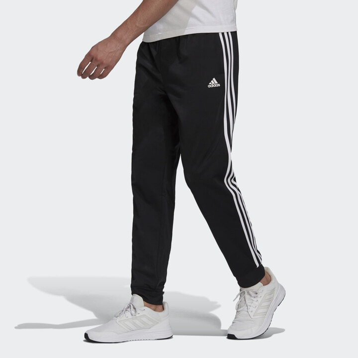 adidas Essentials Warm-Up Tapered 3-Stripes Track Pants - ShopStyle