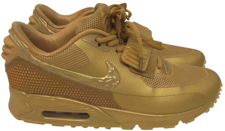 nike gold trainers