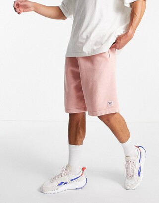 Reebok sweat shorts in pastel pink