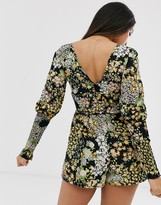 Thumbnail for your product : ASOS DESIGN Petite shirred waist and sleeve long sleeve v neck playsuit in floral print
