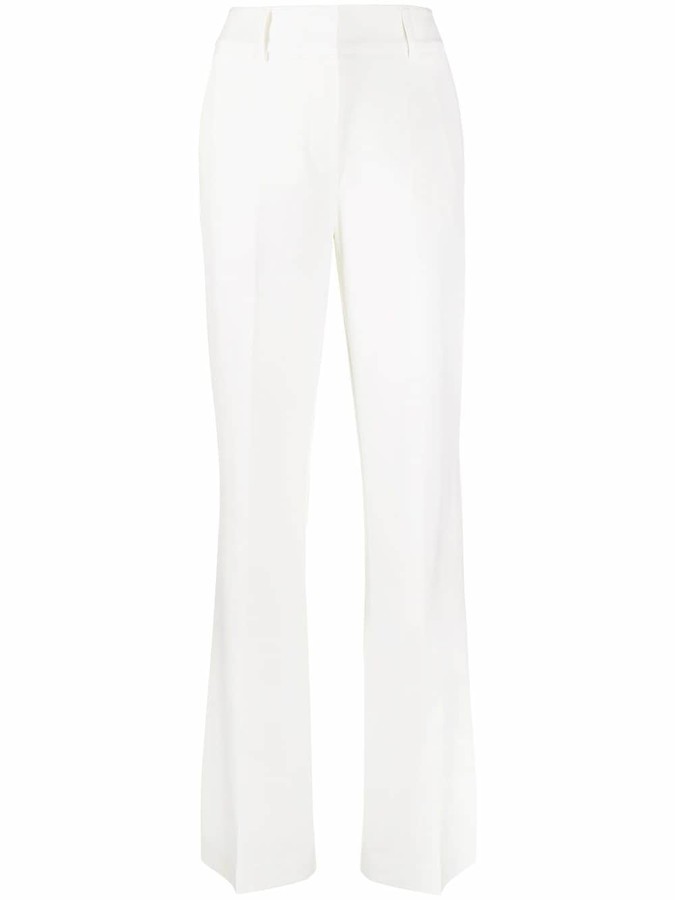 white tight flared trousers