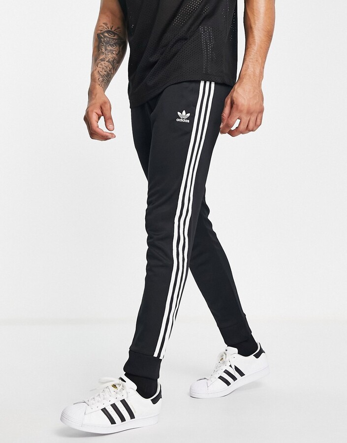 adidas adicolor three stripe skinny joggers in black - BLACK - ShopStyle  Trousers